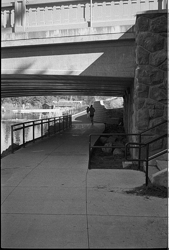 Two people jogging around Mirror Pond, Bend, Oregon.